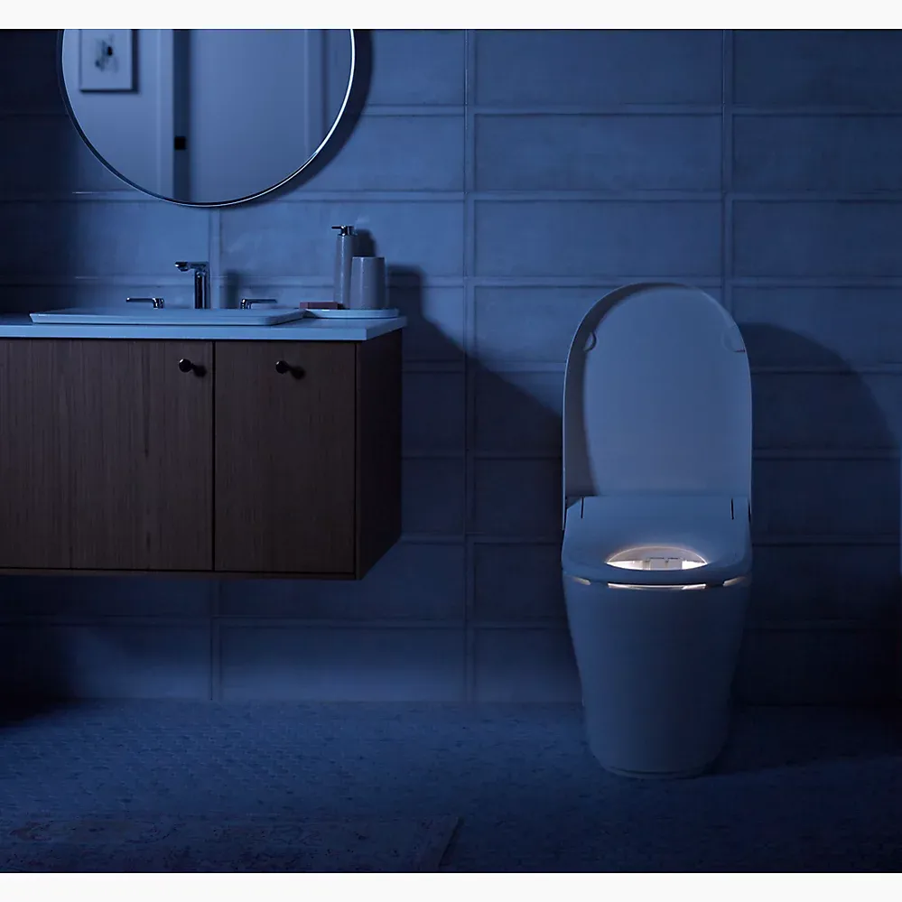 Kohler Innate smart toilet in dark bathroom with night light on