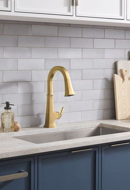 https://www.betterbath-kitchens.com/wp-content/uploads/2021/05/kohler-riff-kitchen-faucet-in-brushed-brass.jpg